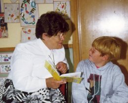 Joy and a young friend share a moment